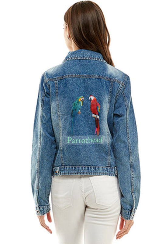 Lady wearing denim jacket featuring a blue macaw and scarlet macaw on the back. Includes Parrothead written beneath the parrots.